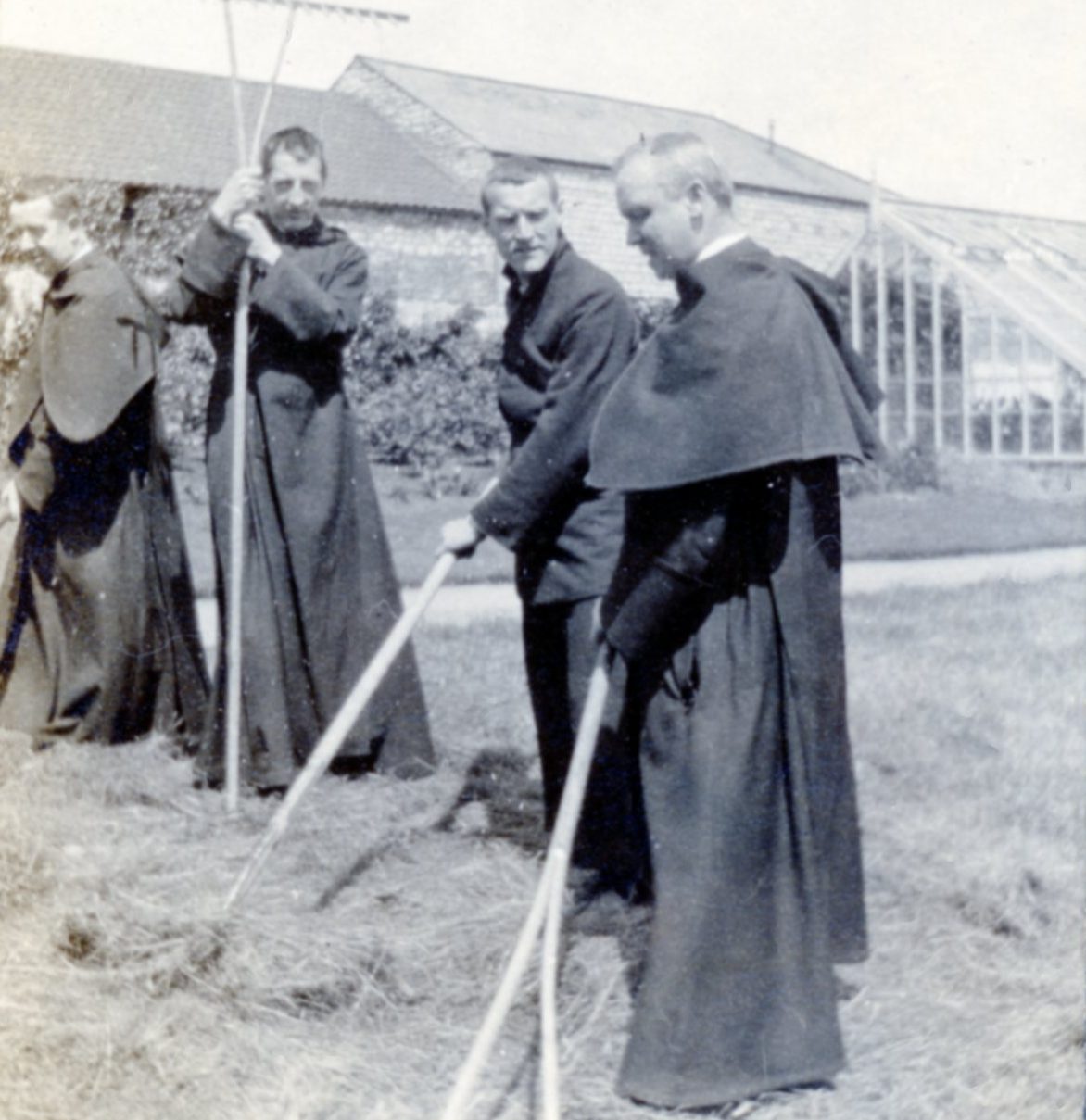 223035 Old image of monks raking hay