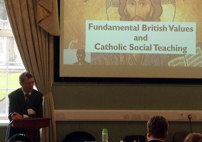 Man presenting fundamental british values and catholic social teaching slideshow